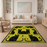 Playful Black Cats on Vibrant Yellow Rug