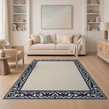 Beige Area Rug with Ornate Black Floral Border