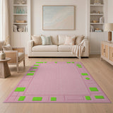 Pink Area Rug with Bold Green Geometric Borders
