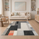 Geometric Black White Area Rug with Orange Accent
