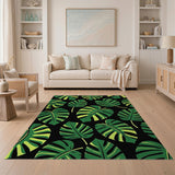 Bold Green Monstera Leaves on Black Area Rug