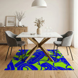 Vibrant Blue Abstract Curves on Green Area Rug