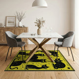 Playful Black Cats on Vibrant Yellow Rug