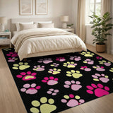 Playful Pink Yellow Paw Prints Black Area Rug