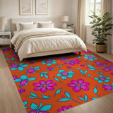 Vibrant Pink Teal Flowers on Orange Area Rug