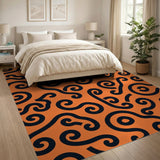 Vibrant Orange Black Swirl Area Rug