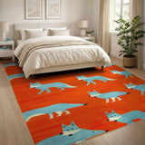 Playful Blue Foxes on Vibrant Orange Area Rug