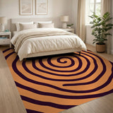 Hypnotic Orange Spiral Area Rug with Black Swirls