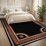 Black Area Rug with Intricate Orange Border