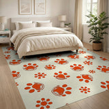 Playful Orange Paw Print Area Rug