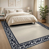 Beige Area Rug with Ornate Black Floral Border