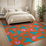 Whimsical Teal Birds on Vibrant Orange Abstract Rug