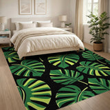 Bold Green Monstera Leaves on Black Area Rug