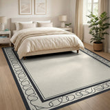 Elegant Beige Area Rug with Ornate Black Border