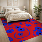 Vibrant Blue Daisy Floral Area Rug on Red