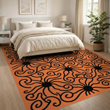 Bold Black Swirls on Vibrant Orange Area Rug