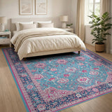 Teal Persian Area Rug with Pink Floral Motifs