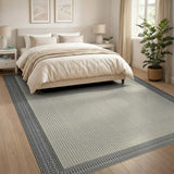Beige Area Rug with Intricate Black Geometric Border