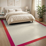 Beige Area Rug with Bold Pink-Orange Border