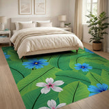 Vibrant Blue Flowers on Lush Green Leaves Area Rug