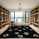 Playful White Paw Print Black Area Rug