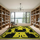 Playful Black Cats on Vibrant Yellow Rug