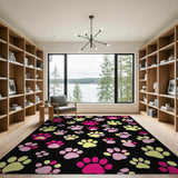 Playful Pink Yellow Paw Prints Black Area Rug