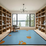 Playful Orange Paw Print Blue Area Rug