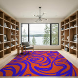 Vibrant Blue Swirl Abstract Area Rug on Fiery Orange
