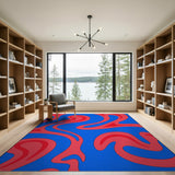 Vibrant Red Swirls on Blue Abstract Area Rug
