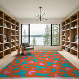 Whimsical Teal Birds on Vibrant Orange Abstract Rug