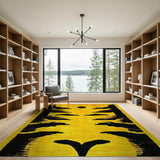 Vibrant Yellow Rug with Bold Black Tribal Silhouettes