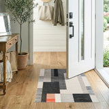 Geometric Black White Area Rug with Orange Accent