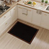 Swirling Black Abstract Area Rug with Bold Orange Border