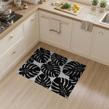 Bold Monstera Leaf Area Rug Black White
