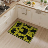 Playful Black Cats on Vibrant Yellow Rug