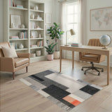 Geometric Black White Area Rug with Orange Accent