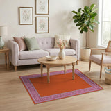 Vibrant Orange Area Rug with Pink Ornate Border