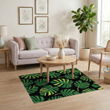 Bold Green Monstera Leaves on Black Area Rug