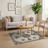 Ornate Beige Area Rug with Bronze Snowflake Motifs