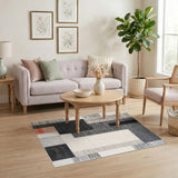 Geometric Black White Area Rug with Orange Accent