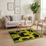 Playful Black Cats on Vibrant Yellow Rug