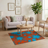 Vibrant Blue Splatter on Orange Abstract Area Rug
