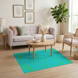 Teal Abstract Area Rug with Vibrant Green Motifs