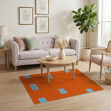 Vibrant Orange Shag Area Rug with Blue Geometric Patches